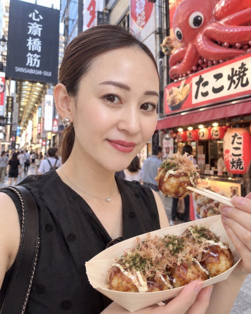 CHIO in Shinsaibashi, Osaka, enjoying takoyaki in the heart of the city.